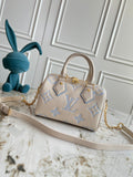 Light-colored embossed leather mini handbag