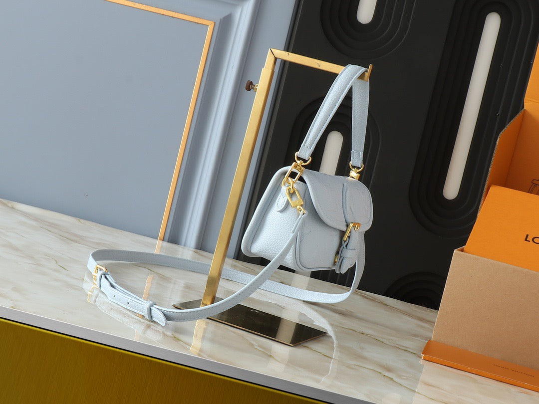 Light-colored embossed leather mini handbag collection