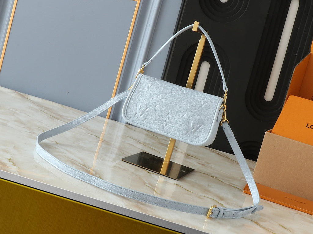 Light-colored embossed leather mini handbag collection