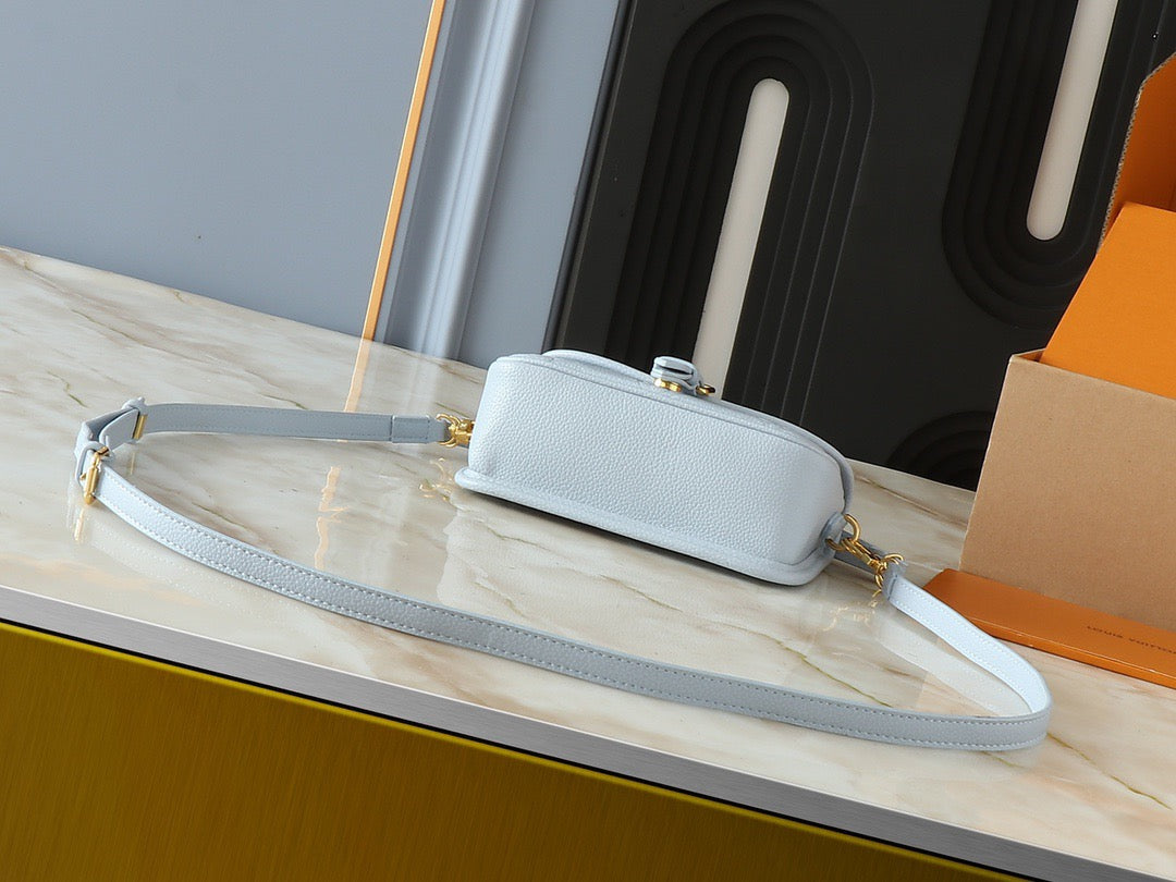Light-colored embossed leather mini handbag collection