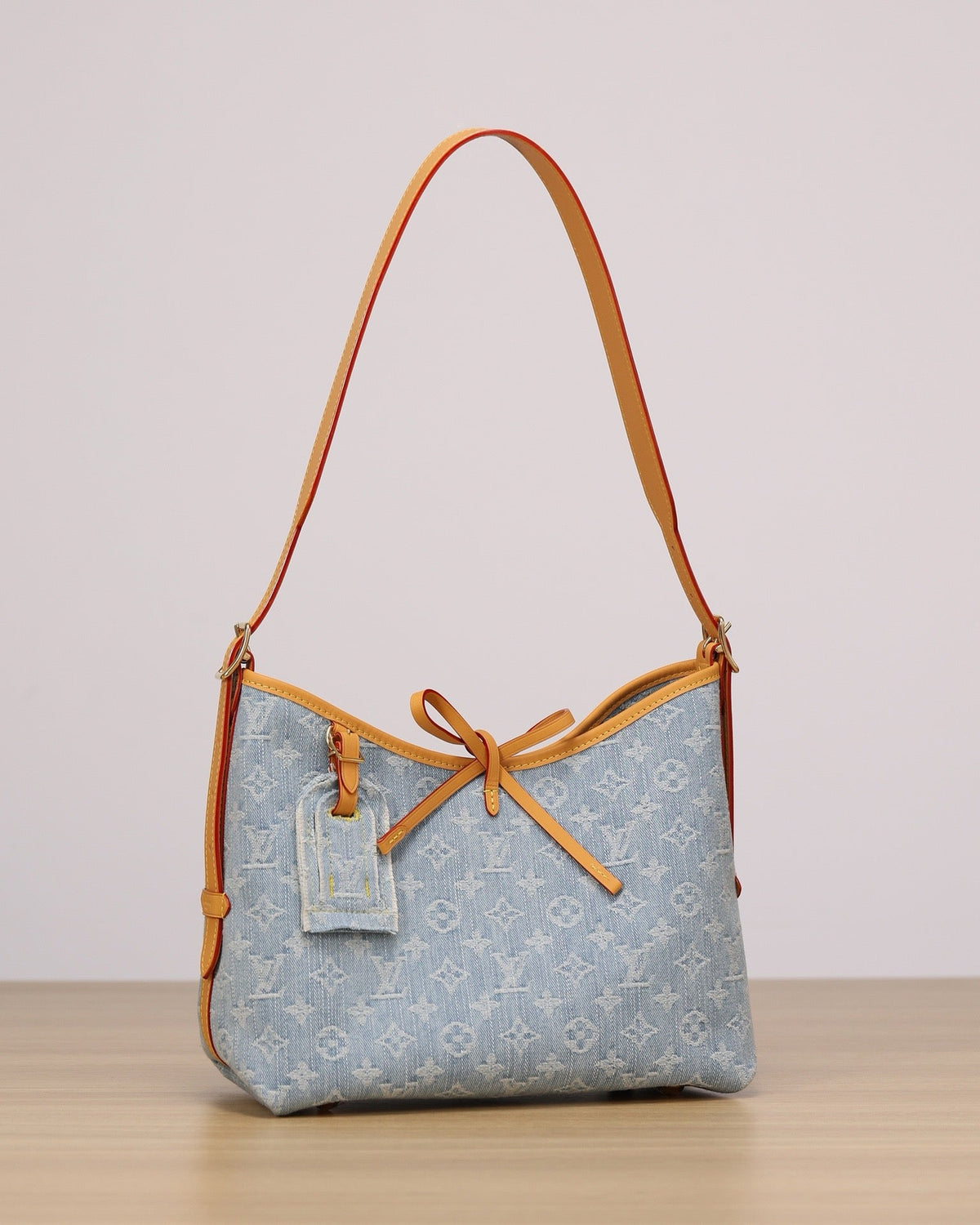 2026 CarryAll PM Handbag, Blue Monogram Denim M11462